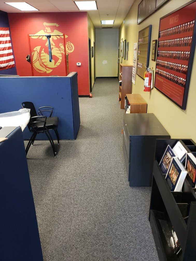 A hallway with a marine emblem on the wall