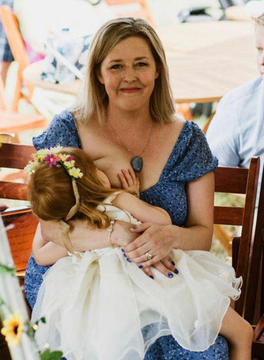 Laine breastfeeding her daughter Etta