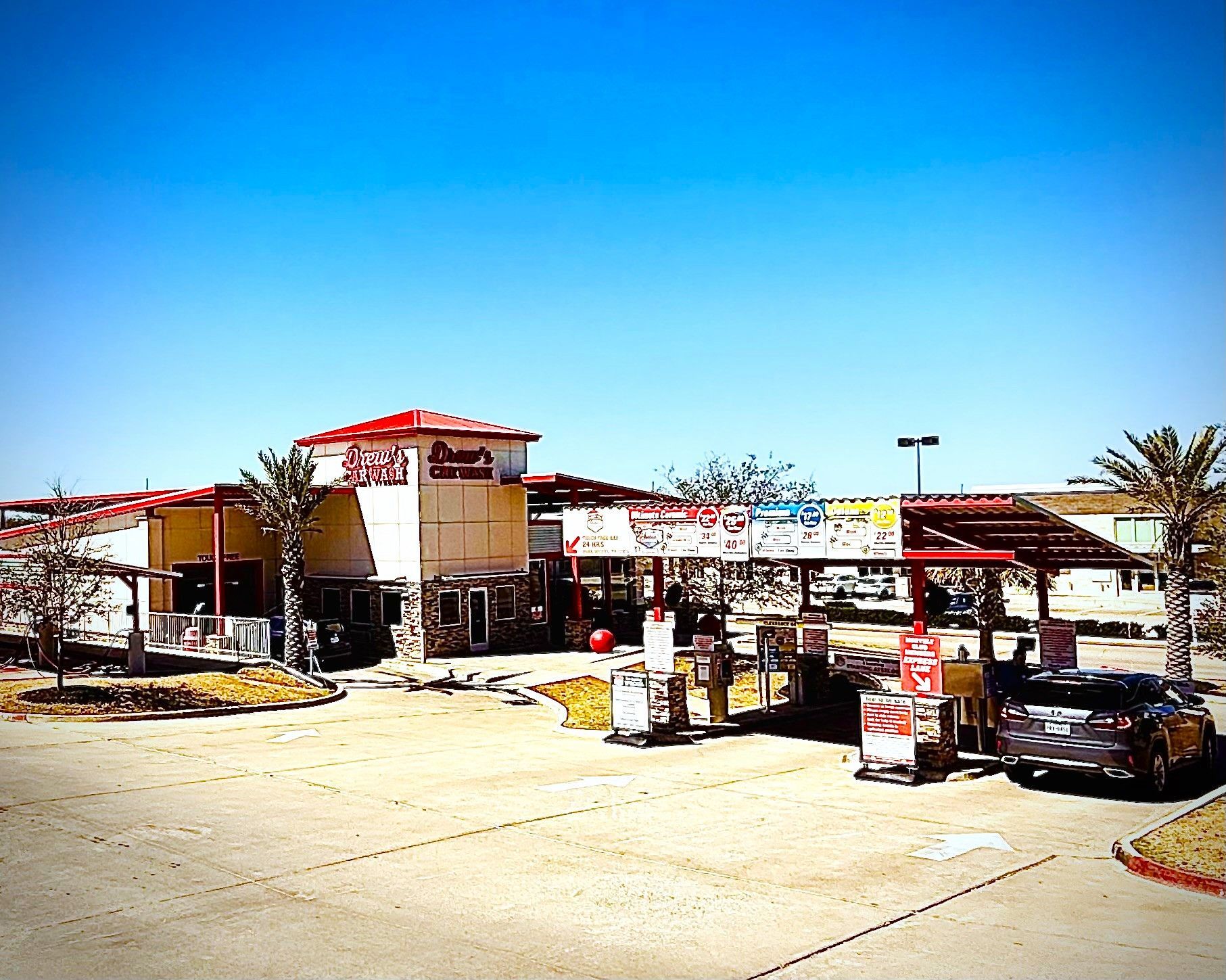 A car wash with a truck parked in front of it