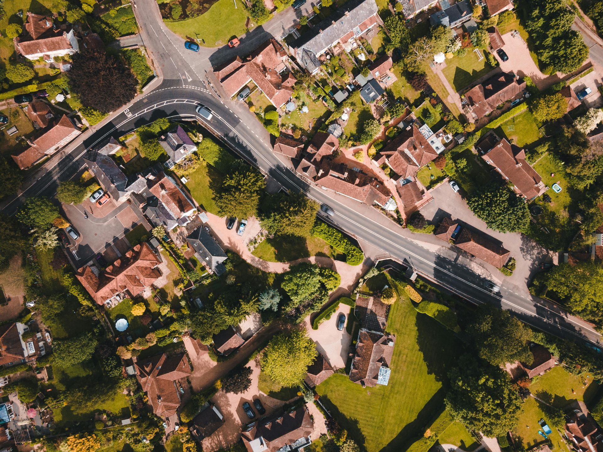 An aerial view of a residential area with lots of houses and trees.