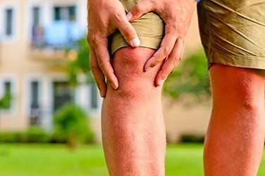 Man having sore knee — Rheumatoid Arthritis Treatment in Toms River & Whiting, NJ