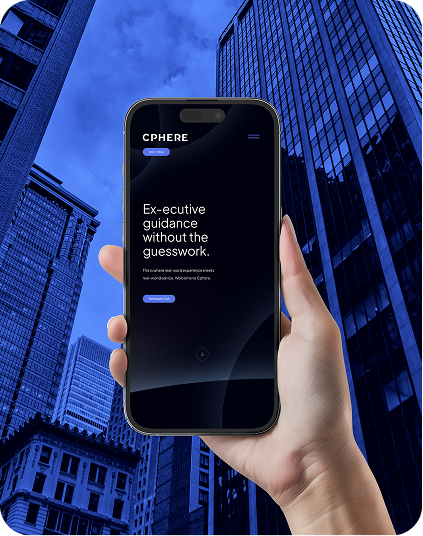 Hand holding a phone displaying a website with the word 