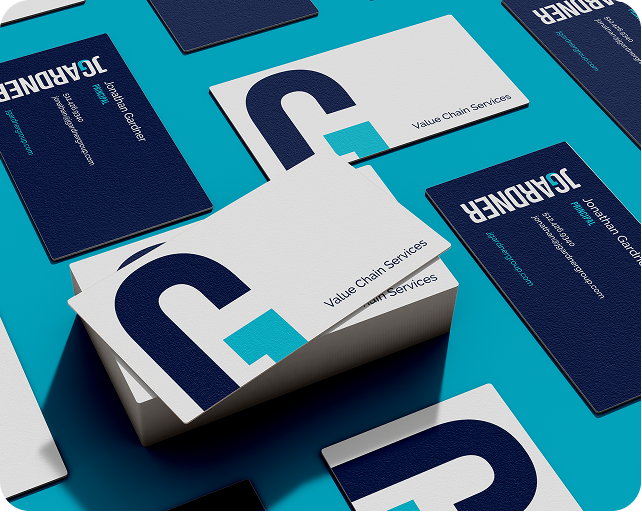Business cards with logo, stacked and scattered on blue background. Dark blue, white, and teal colors are used.