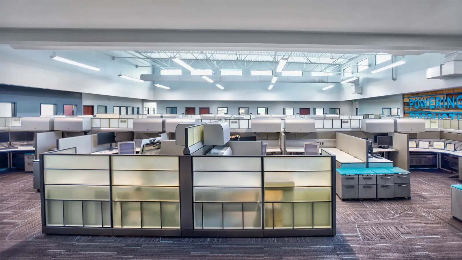 Flag with vertical stripes: black, teal, white, purple, and light blue.