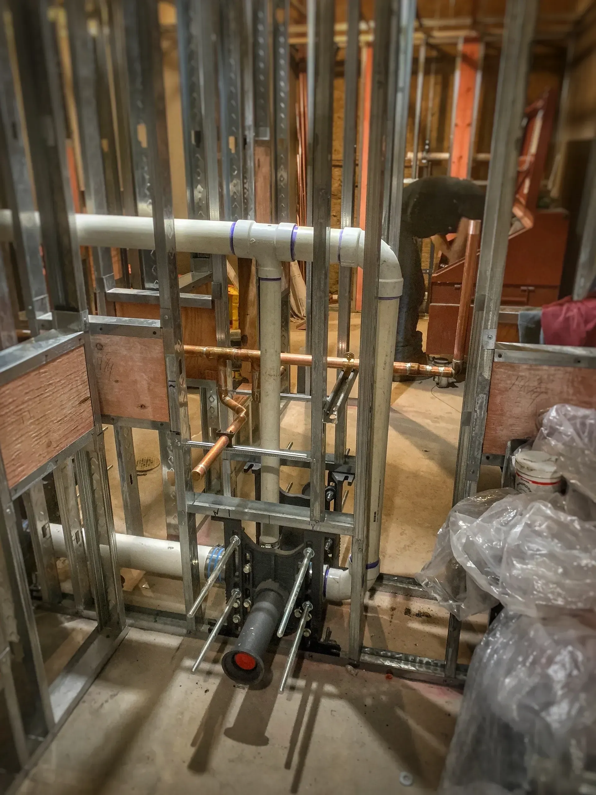 A room with a lot of pipes going through it.