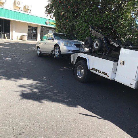 Towed Gray Sedan - Maui Auto Recycling in Puunene, HI