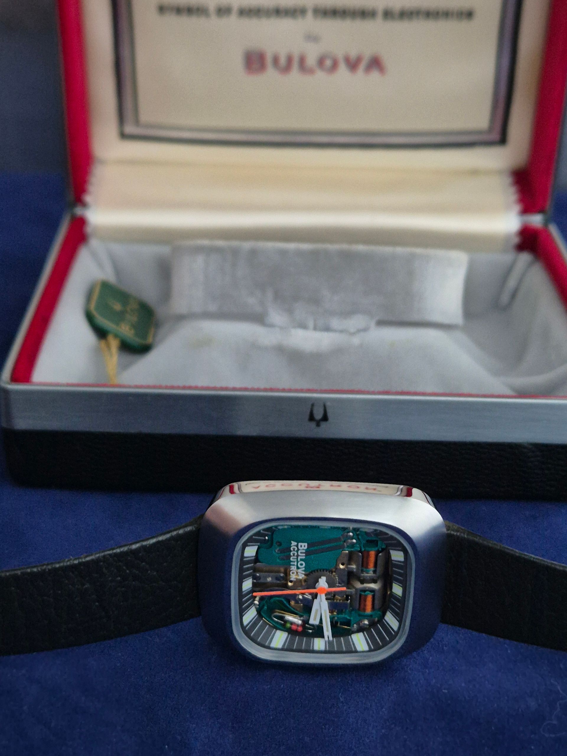 Bulova Accutron watch with exposed circuit board, in its open presentation box.