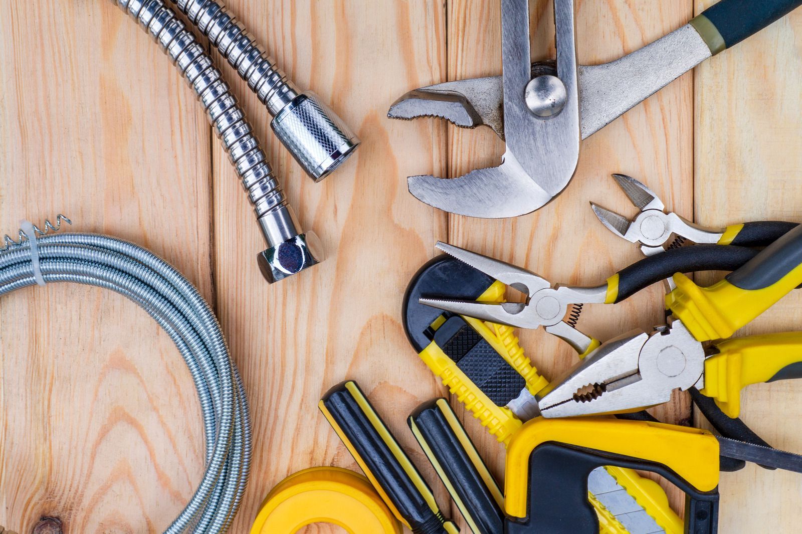 a bunch of tools are sitting on a wooden table