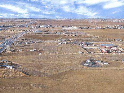 An aerial view of a small town in the middle of a desert.