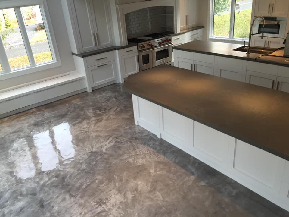 A kitchen with a large island in the middle of the room.