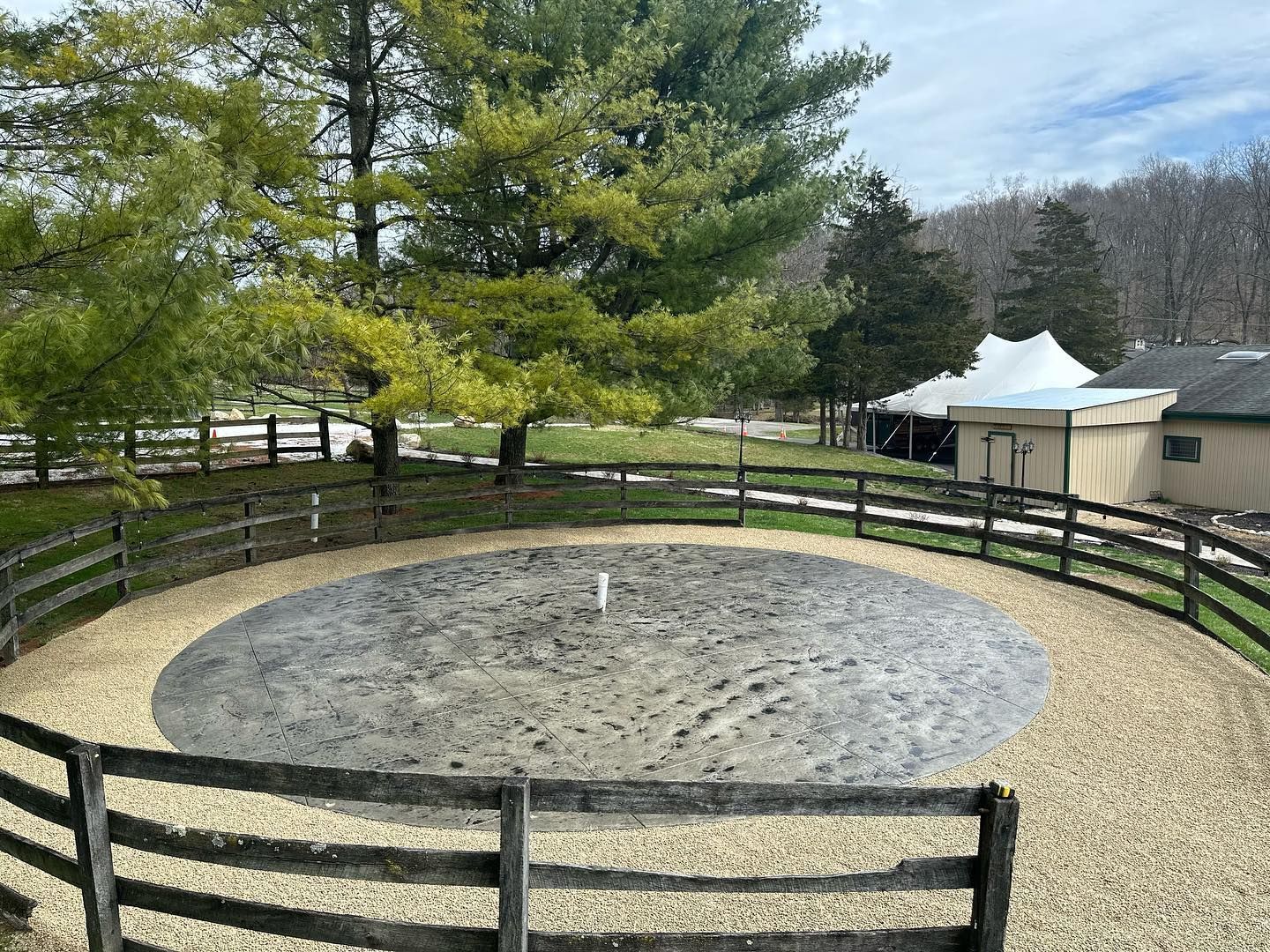 A large circular area with a wooden fence around it.
