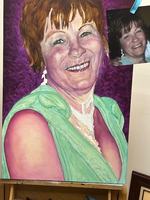 A painting of a smiling woman in a green dress