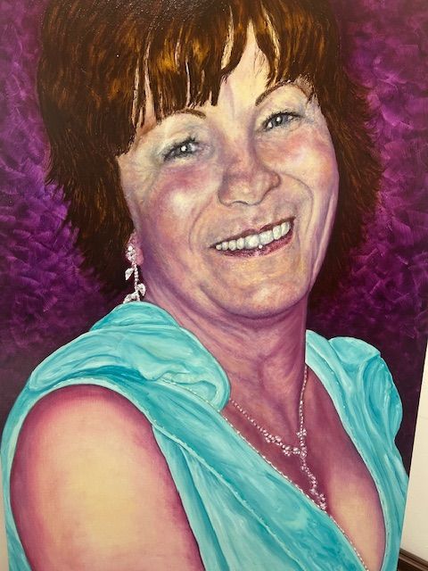 A woman in a blue dress is smiling in a painting