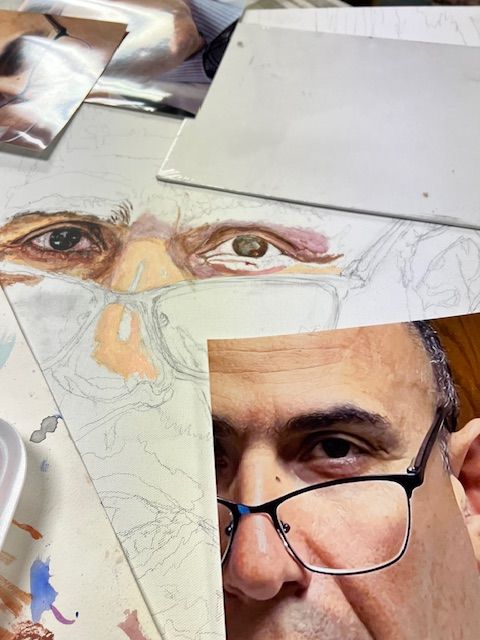 A close up of a man wearing glasses and a mask