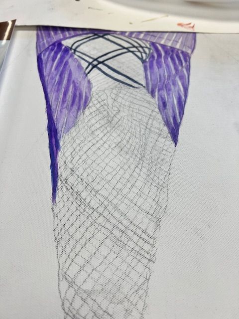 A piece of paper with a drawing of a butterfly on it