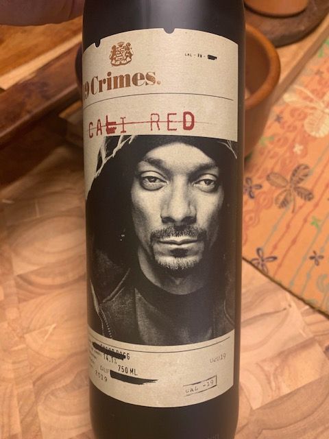 A bottle of wine with a picture of snoop dogg on the label