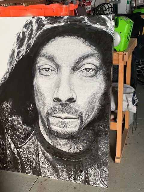 A black and white portrait of snoop dogg