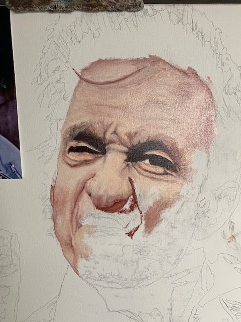 A close up of a painting of a man with a beard