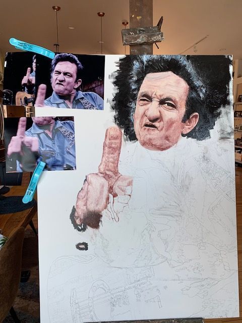 A painting of johnny cash is being worked on