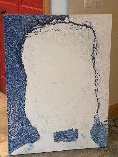 A painting of a man with a beard is being painted