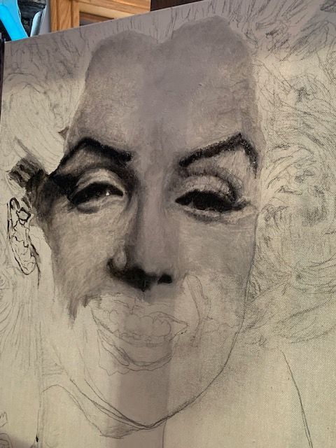 A black and white drawing of a woman 's face