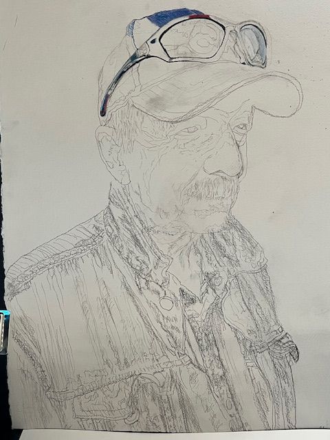 A pencil drawing of a man wearing a hat and glasses.