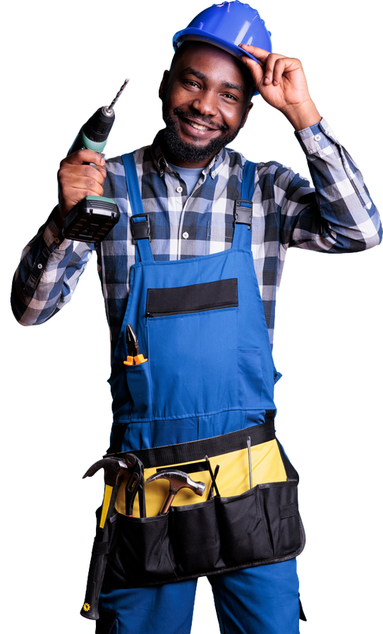 A man wearing overalls and a hard hat is holding a drill.