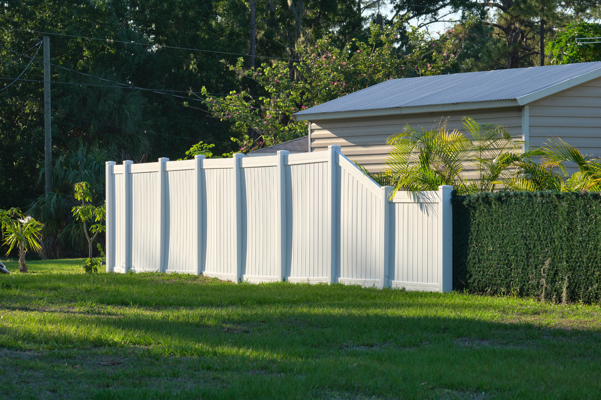 White plastic fence for back yard protection and privacy