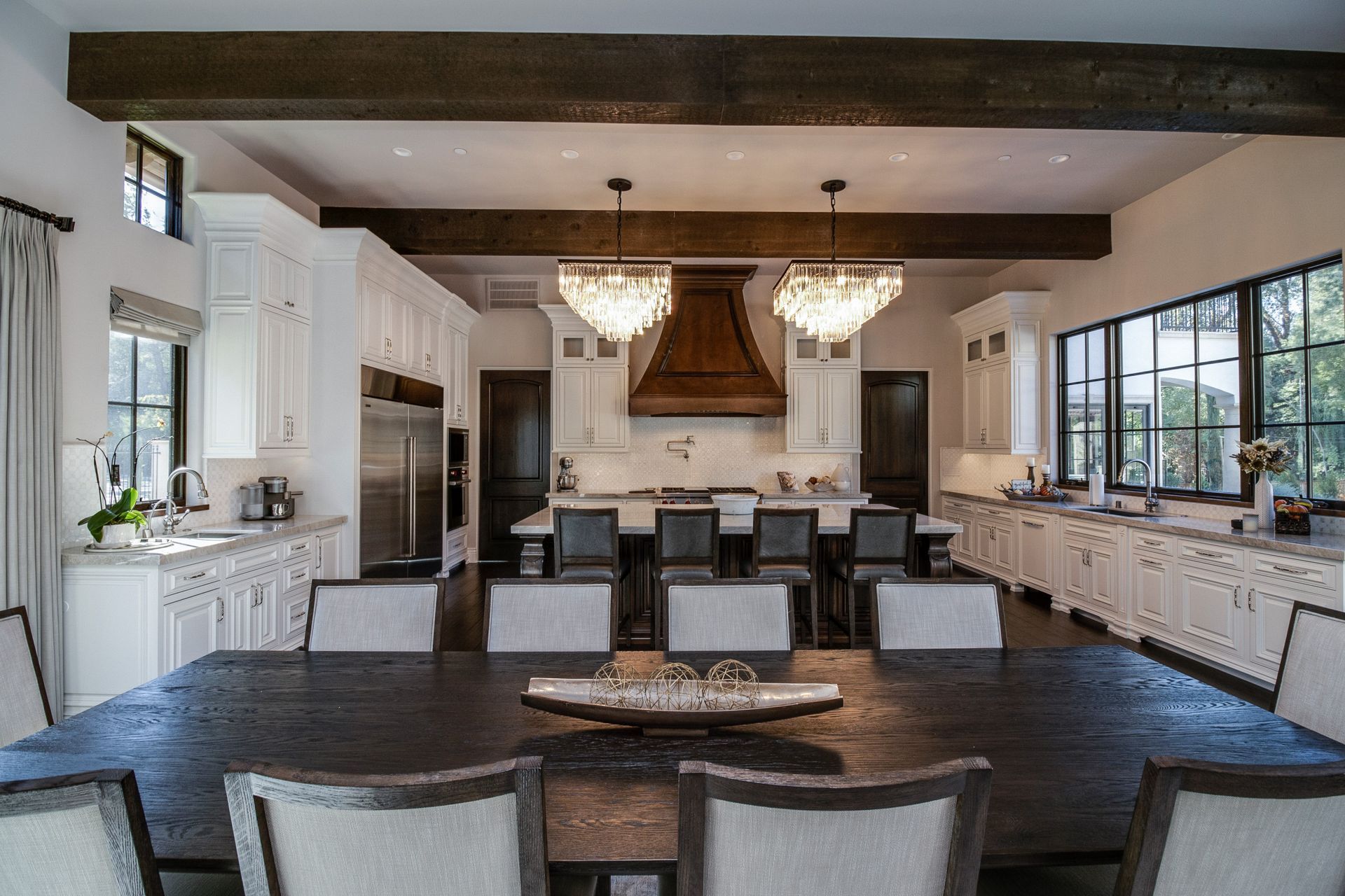A large kitchen with a dining room table and chairs