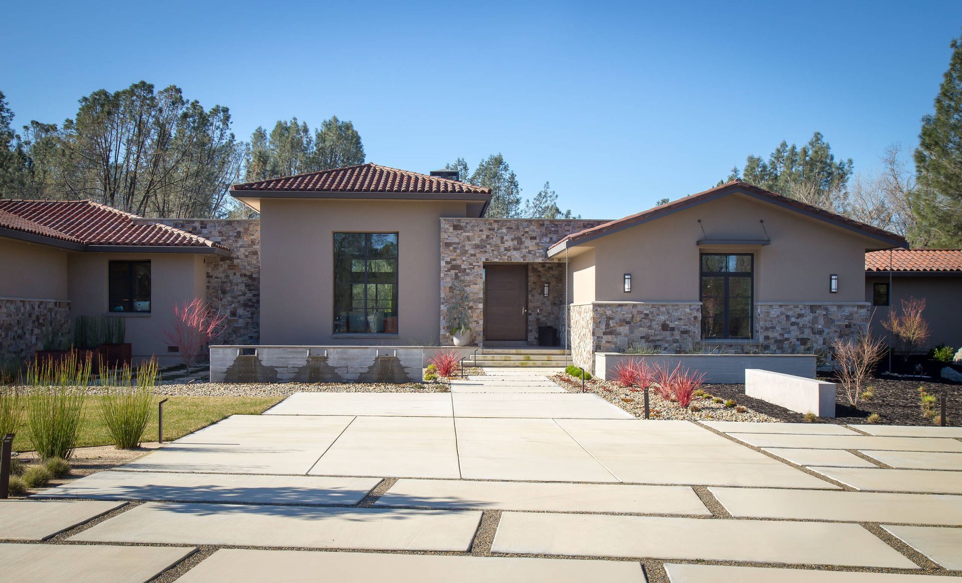 A large house with a driveway leading to it