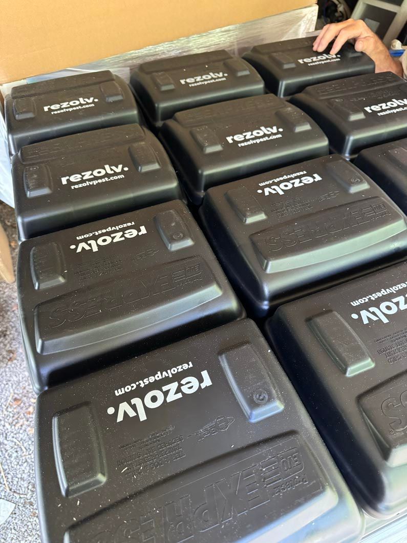 A bunch of black boxes with the word rezolv on them