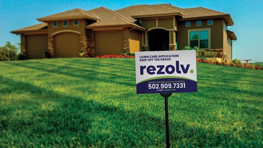 A house with a for sale sign in front of it