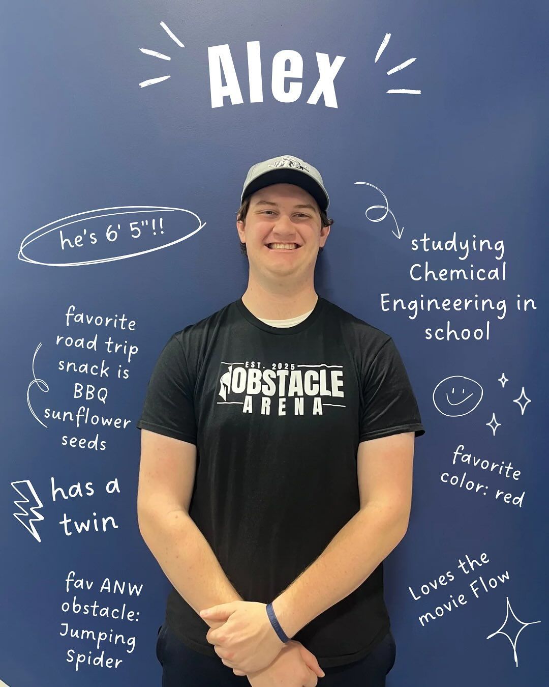 Man named Alex smiling, standing in front of a blue wall with text describing his interests, hobbies, and major.