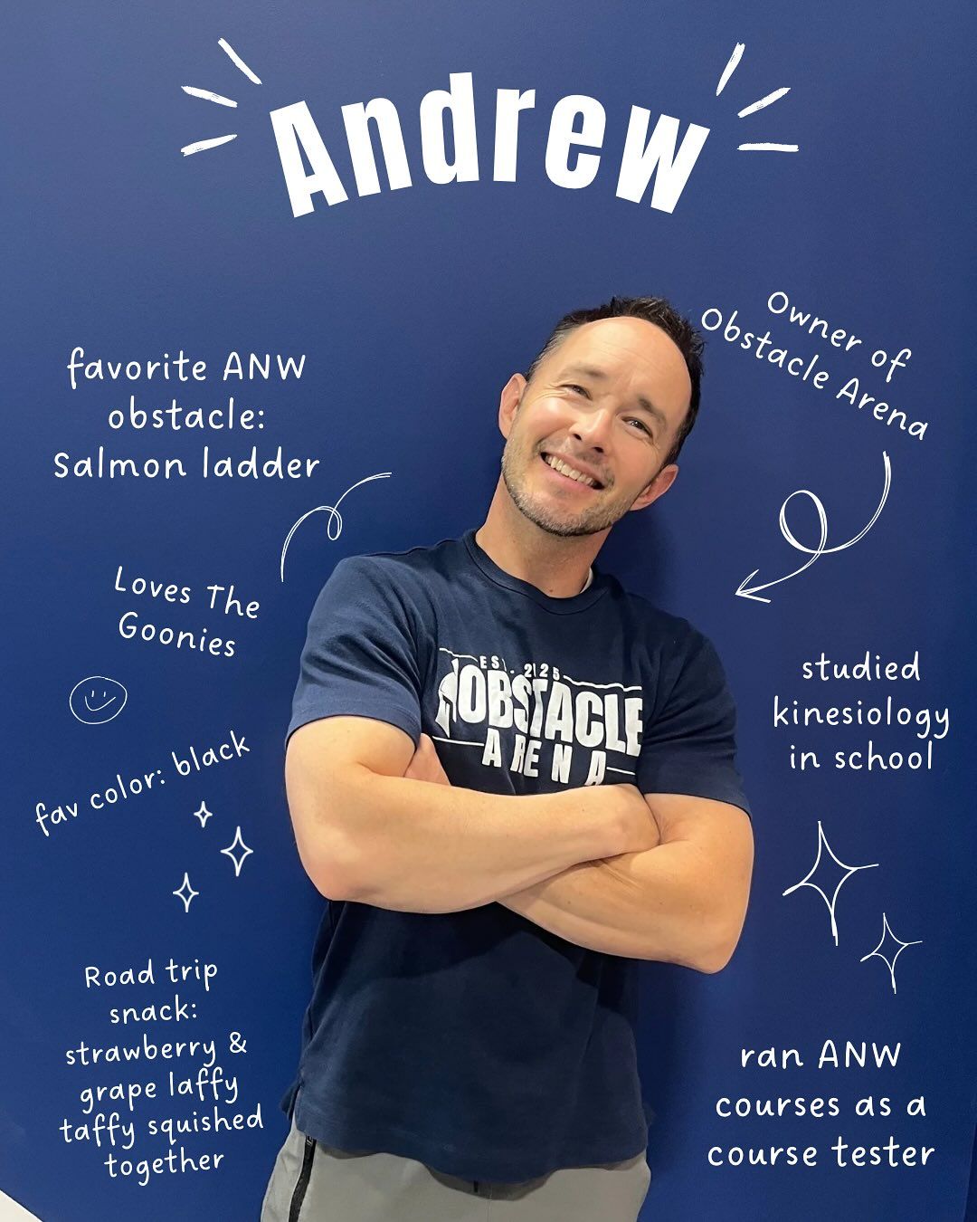 Andrew, smiling with crossed arms in front of a blue wall with facts about him.