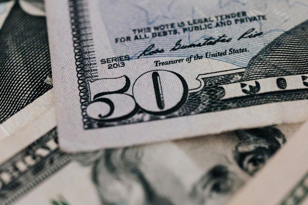 Close-up of a $50 bill, with 