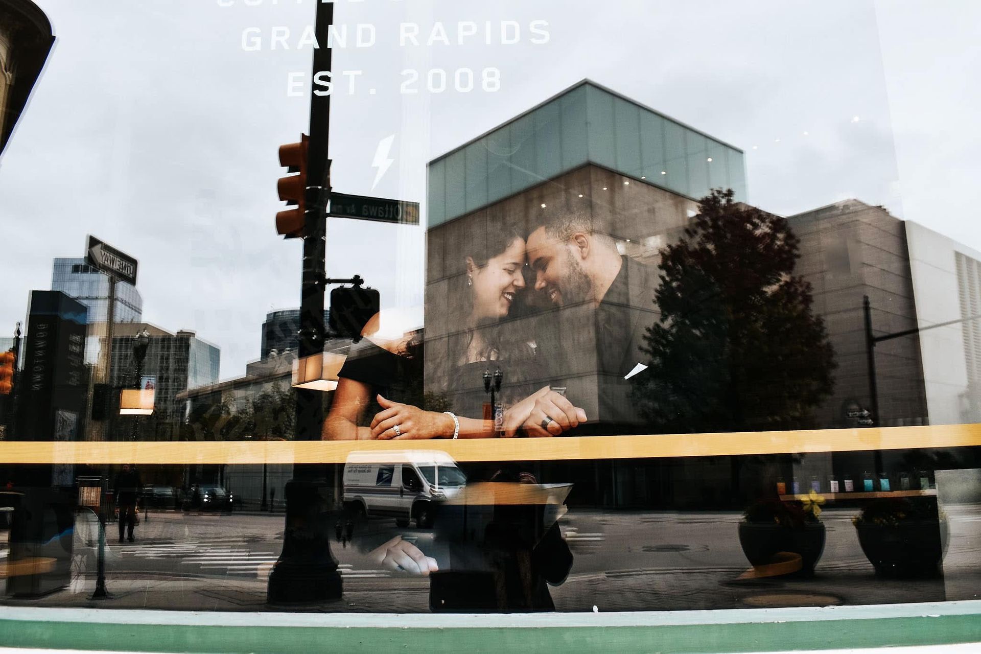 a couple embraces in a cafe