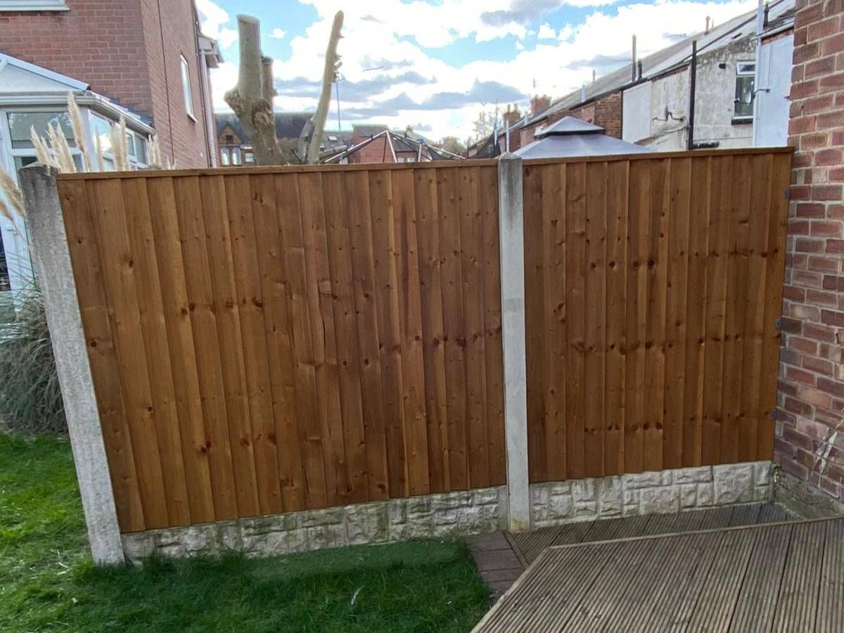 Nottingham Fencing removing old wooden panels from a fence in Newark