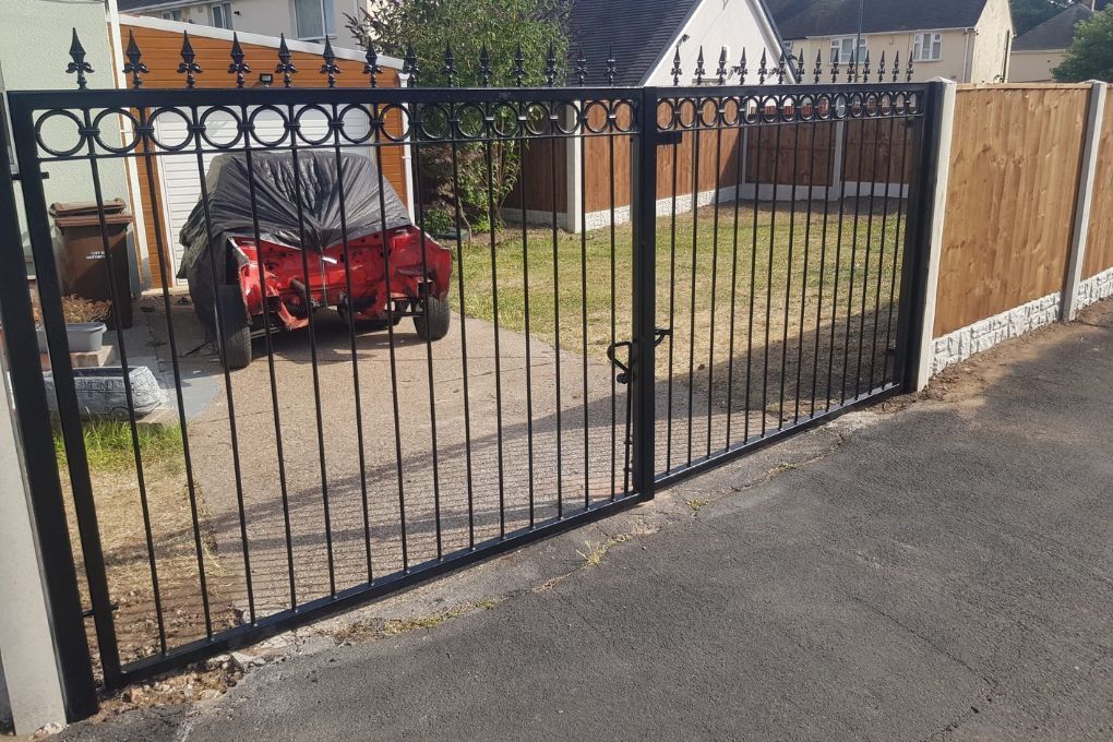 Nottingham Fencing All black double metal driveway gates with black spear tops and ring detailing