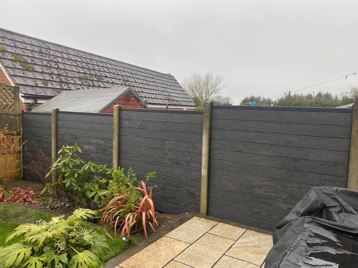 fence after replacement composite panels fitted into existing concrete posts in Sutton in Ashfield