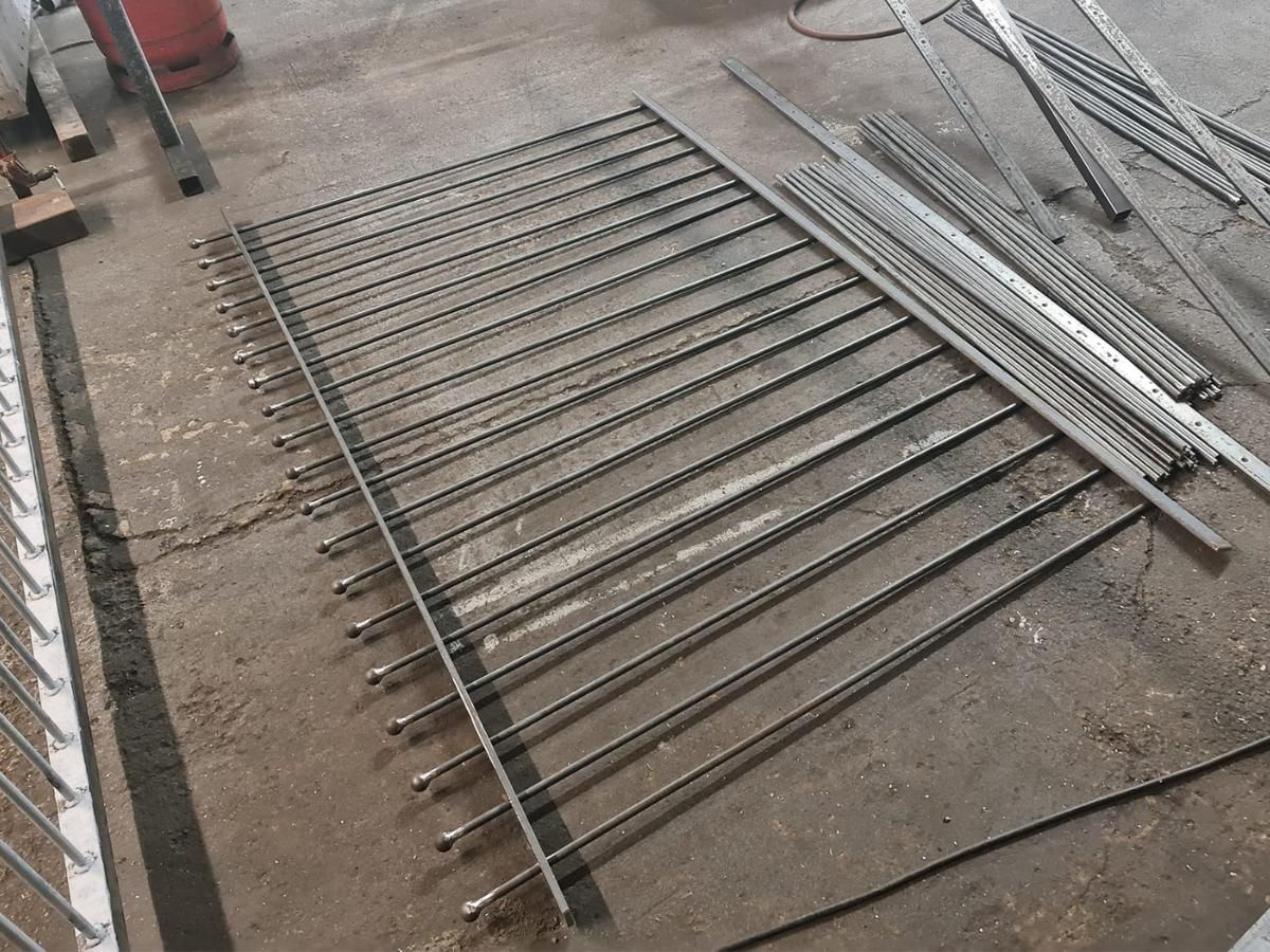 Nottingham Fencing ball top railings being attached together