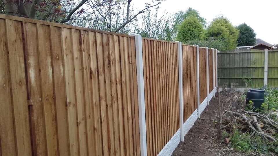 Nottingham Fencing removing old wooden panels from a fence in Kimberley