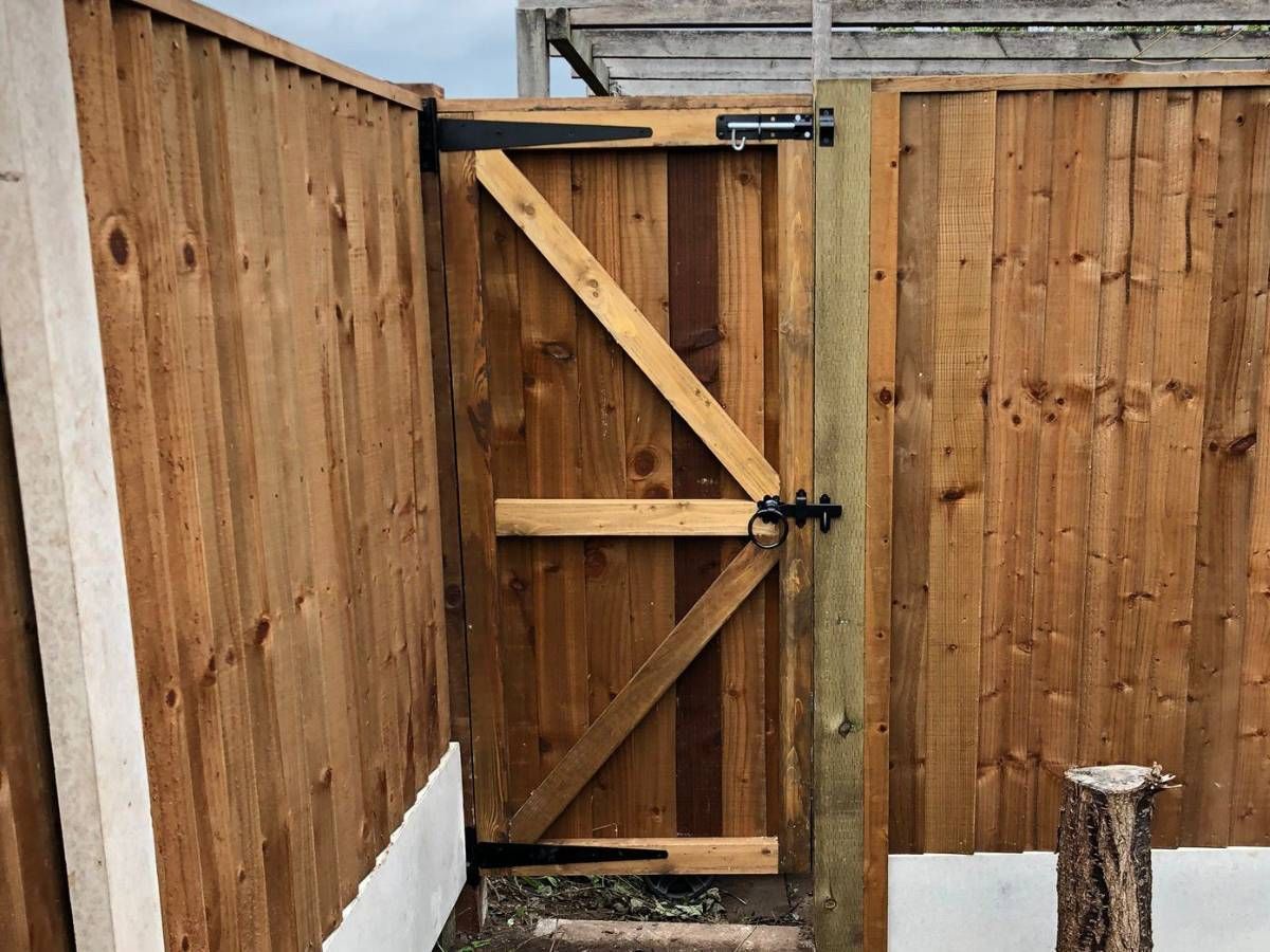 inside view of a wooden gate fitted to wooden fencing