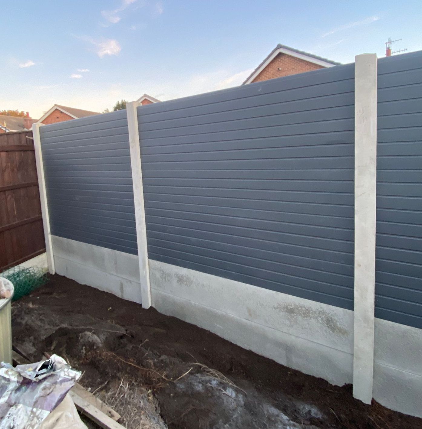 Nottingham Fencing grey composite fencing installed between concrete posts