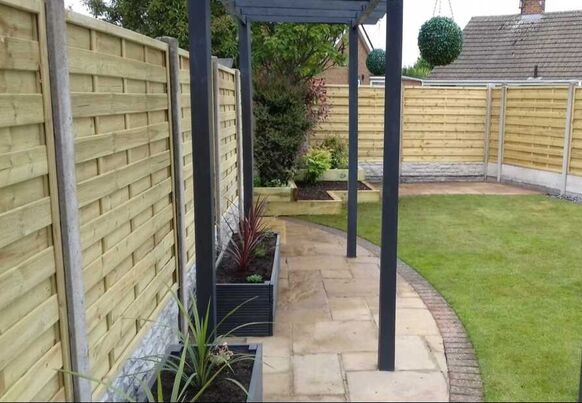 Nottingham Fencing landscaping services including new fencing, a patio and pathway and wooden pergola