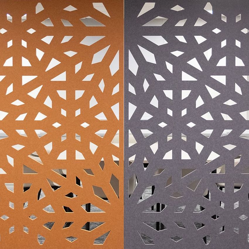 Close up of patterned acoustic panels in grey and orange.