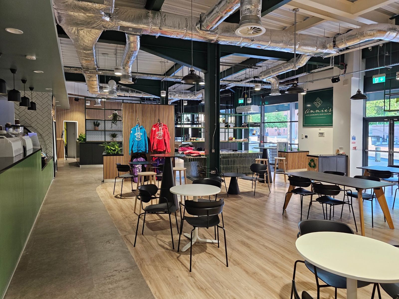 View of the interior of Annie's Cafe, including seating areas & retail counter