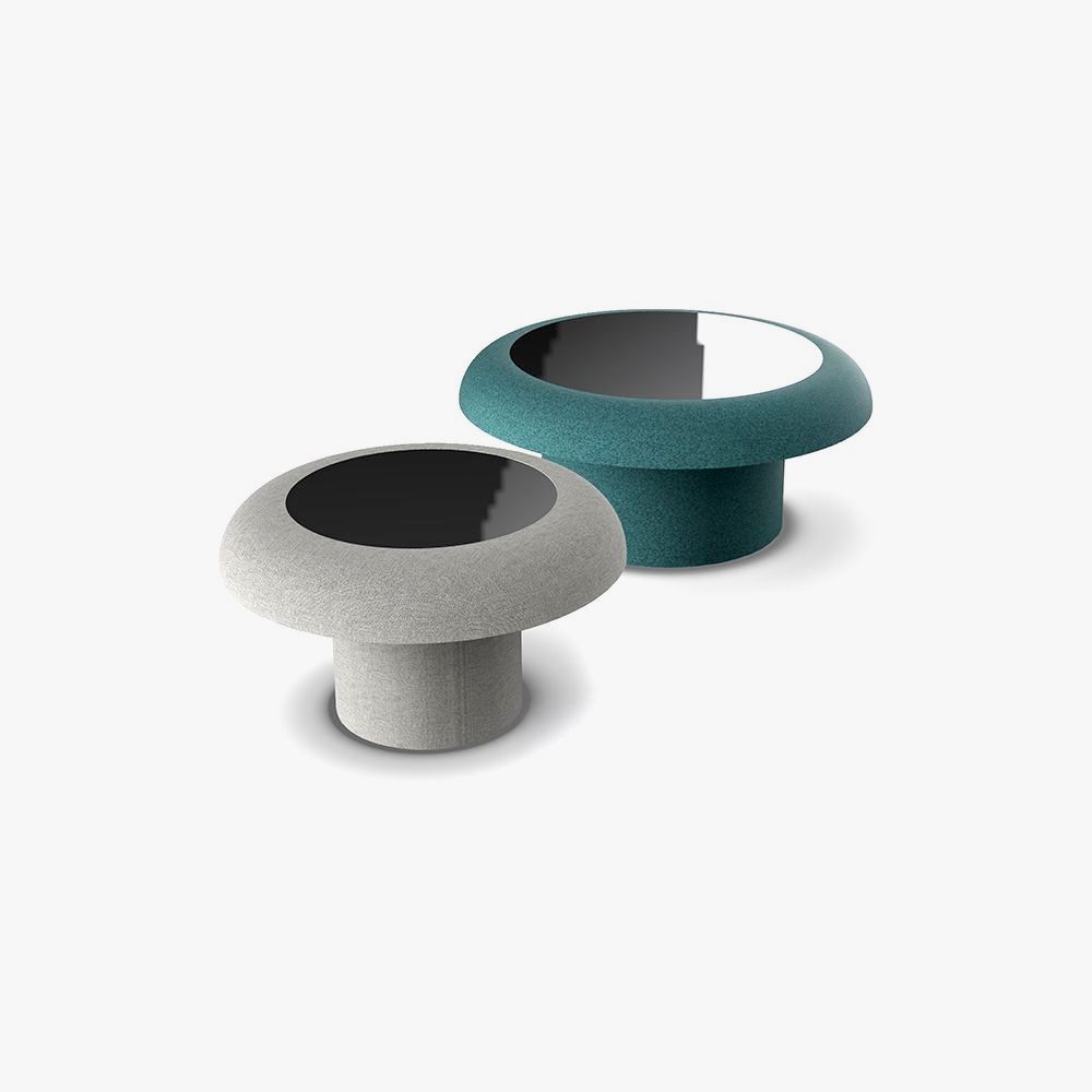 Two textured controller thumbsticks, gray and teal, with black interiors.