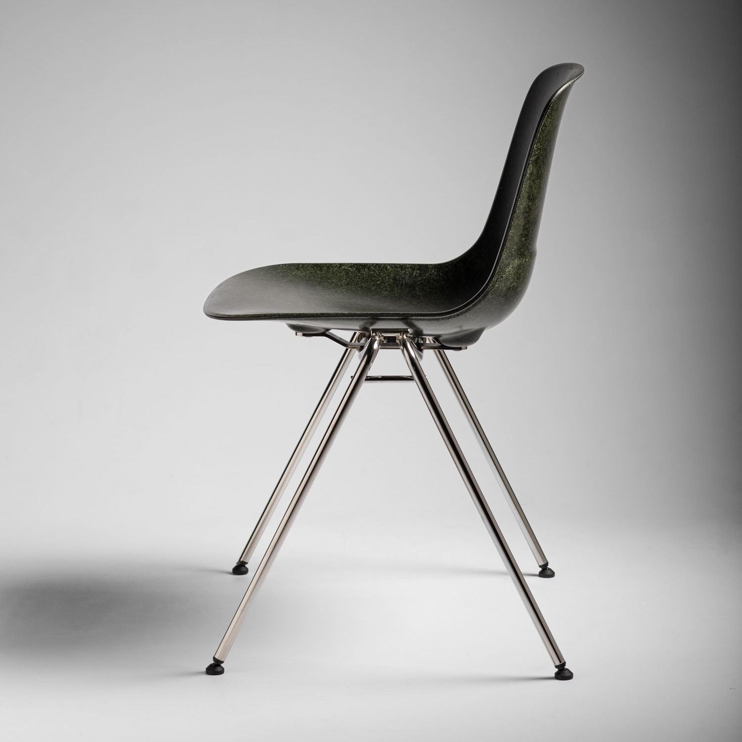 Forest Welsh Mountain Solidwool shell chair with chrome plated steel legs facing left.