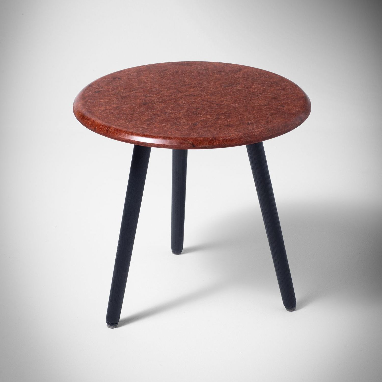 Tan Hembury side table with scorched ash legs.