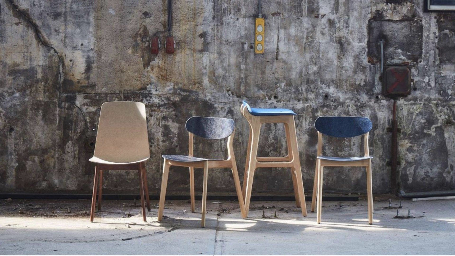Wooden leg chairs and stools upholstered using recycled denim fabric.